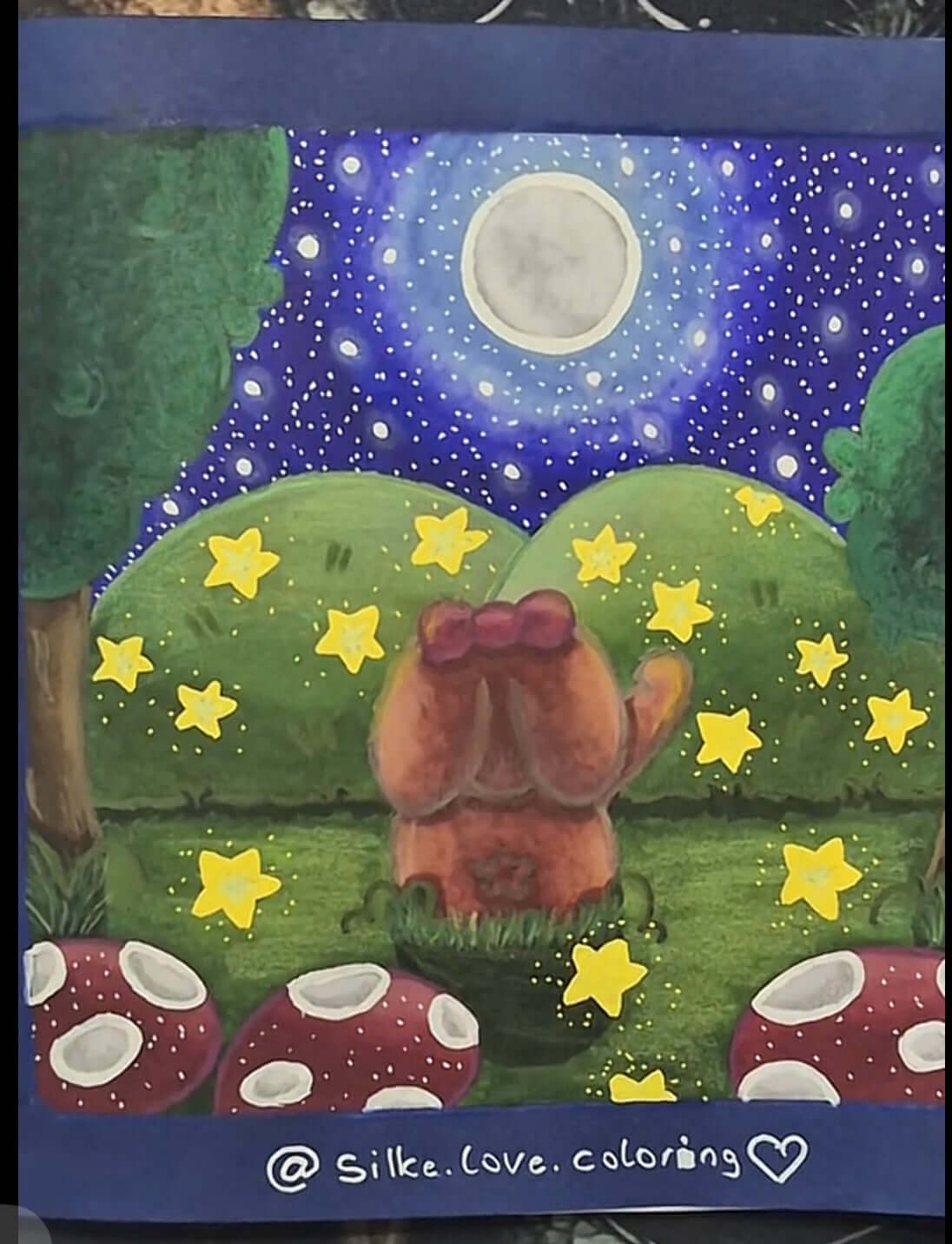 Close up completed colouring page featuring “Forest Friends” by Willow Tree Colouring Studio’s fans.