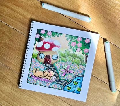 Premium thick paper pages showing completed artwork inside the woodland colouring book.