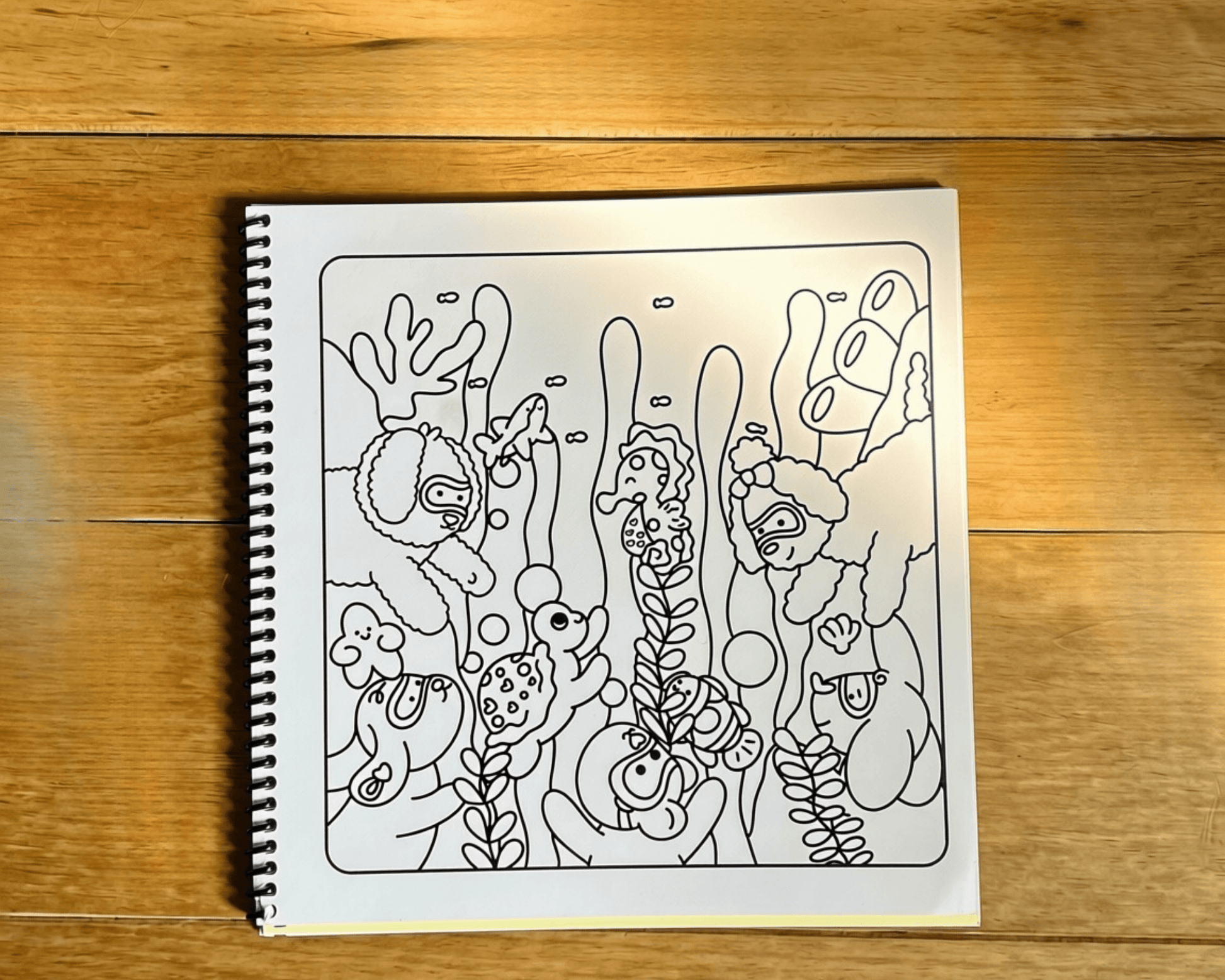 Intricate uncoloured line art illustration of underwater plants and bubbles on premium paper.