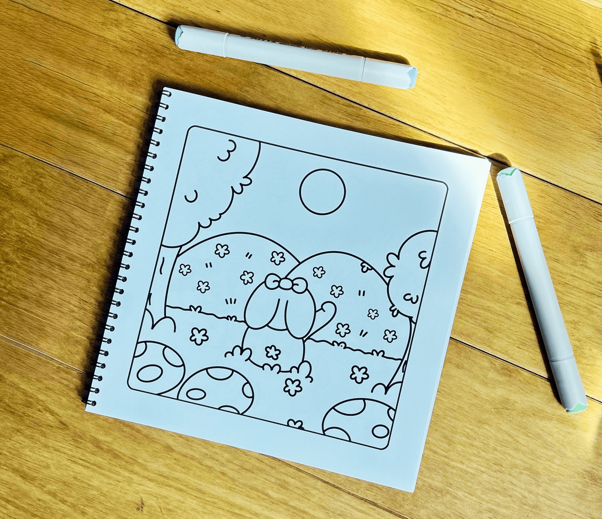 Detailed woodland line art illustration inside the Forest Friends wire-bound colouring book.