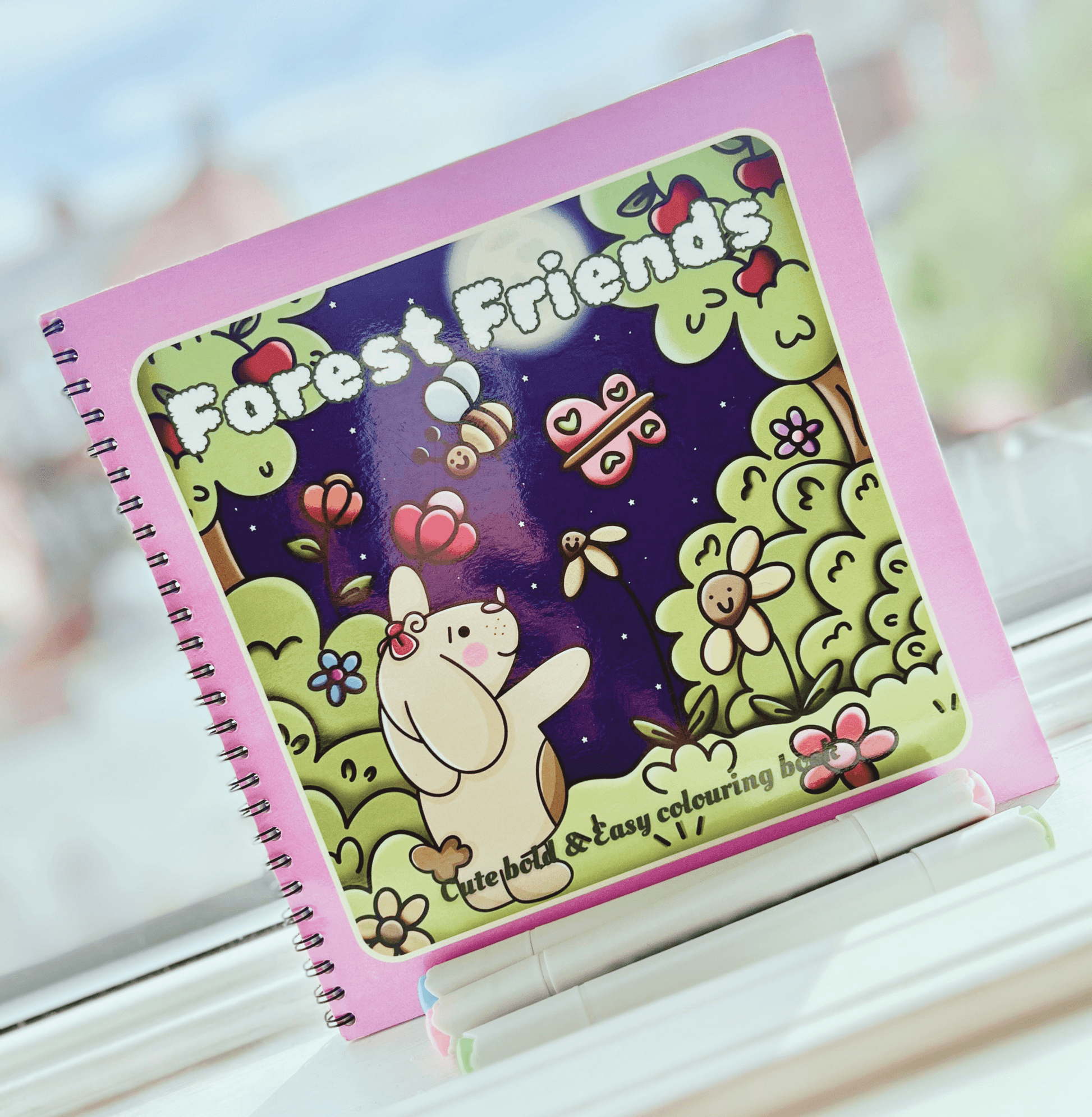 Forest Friends wire-bound woodland colouring book cover featuring vibrant fairytale illustrations.