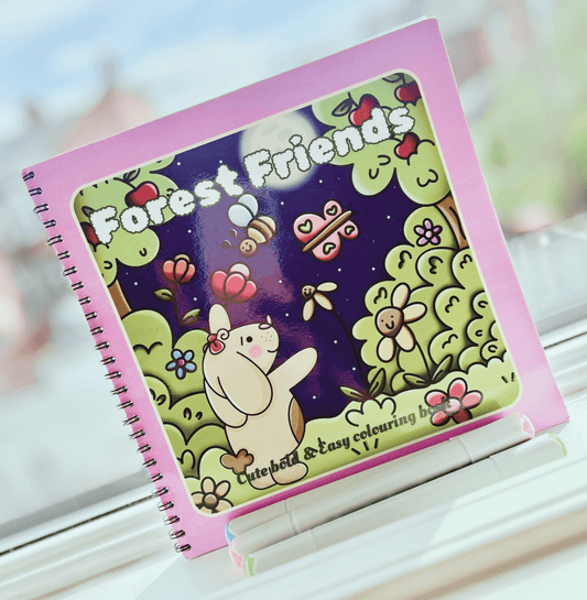 Forest Friends wire-bound woodland colouring book cover featuring vibrant fairytale illustrations.